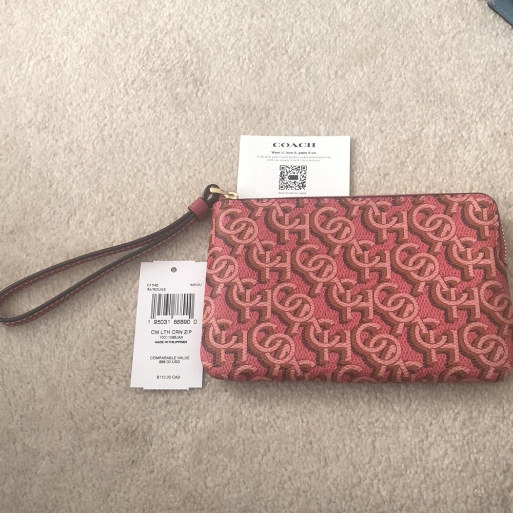 NWT Coach pink leather wristlet with gold hardware
